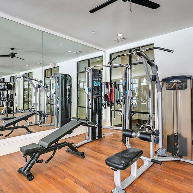 Fitness center weight machines at The Huntington Apartments in Plano, TX