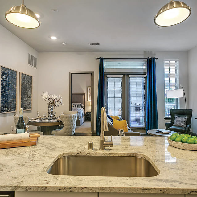 Kitchen island sink at The Huntington Apartments in Plano, TX